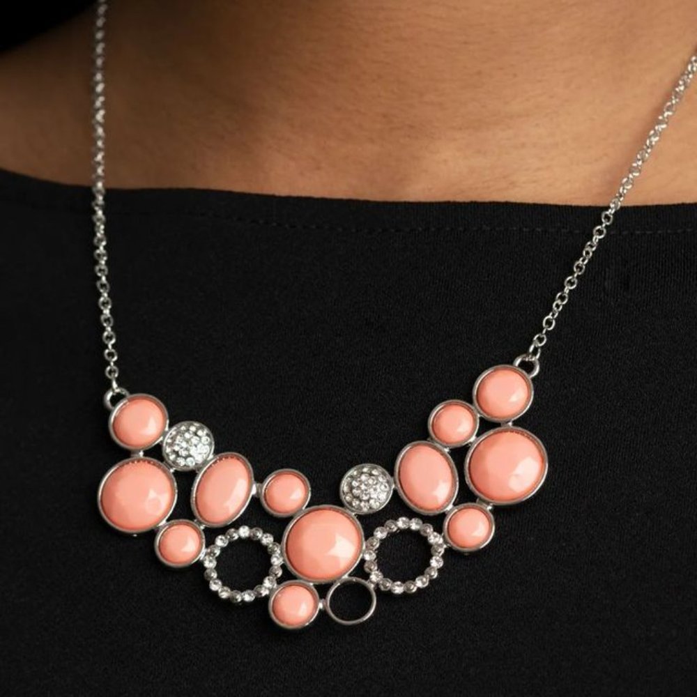 Necklace, faceted coral beaded frames and white rhinestone